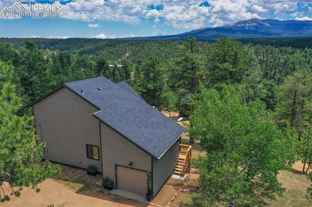 birds eye view of property with a mountain view