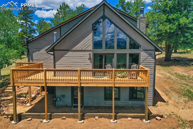 rear view of house featuring a deck