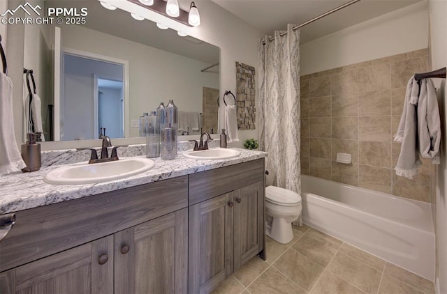 full bathroom with shower / tub combo, vanity, tile patterned floors, and toilet