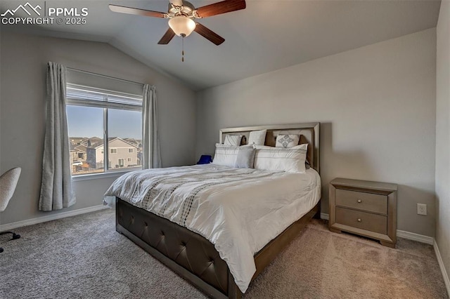 carpeted bedroom featuring ceiling fan and vaulted ceiling