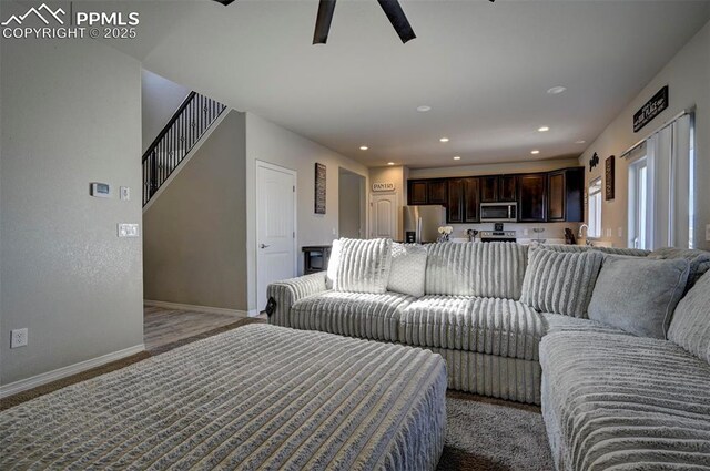 living room featuring ceiling fan