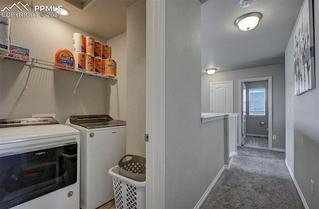 laundry room featuring light colored carpet and washer and dryer