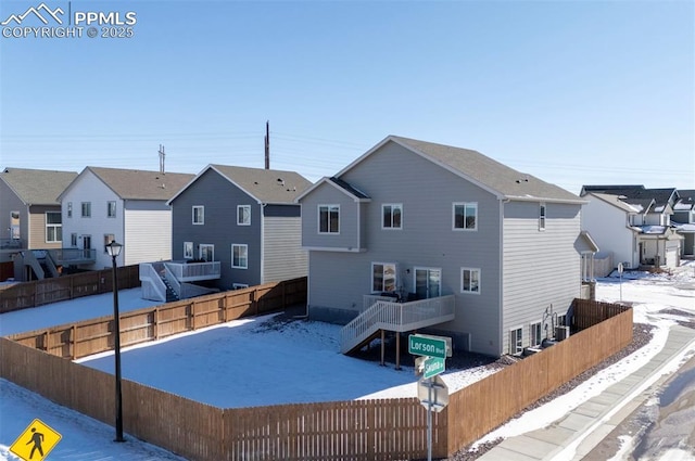 view of snow covered property