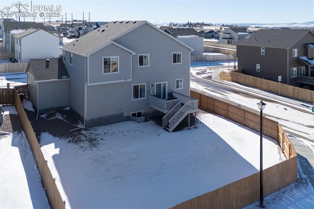 view of snow covered property