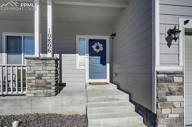 doorway to property with covered porch