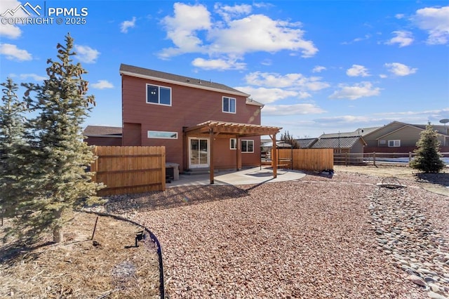 back of house featuring a pergola and a patio area