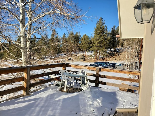 view of snow covered deck