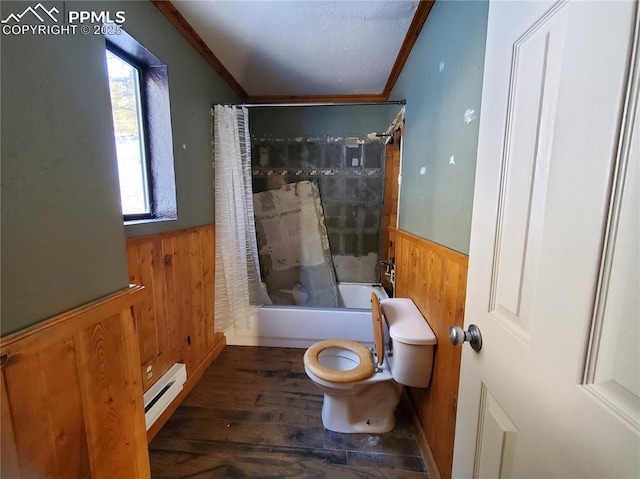 bathroom with toilet, wood walls, crown molding, shower / tub combo, and a baseboard radiator