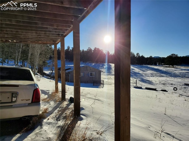 view of snow covered patio