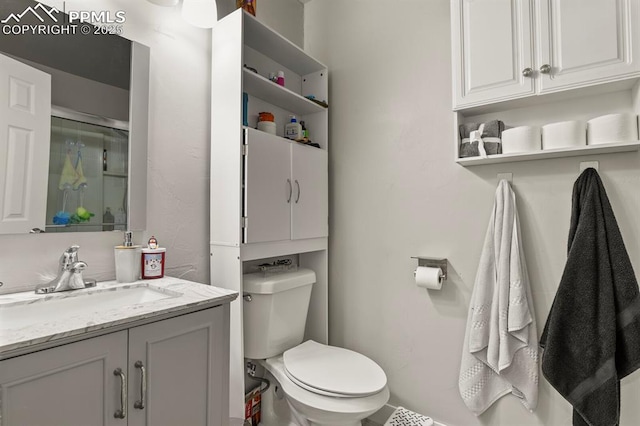 bathroom featuring vanity and toilet