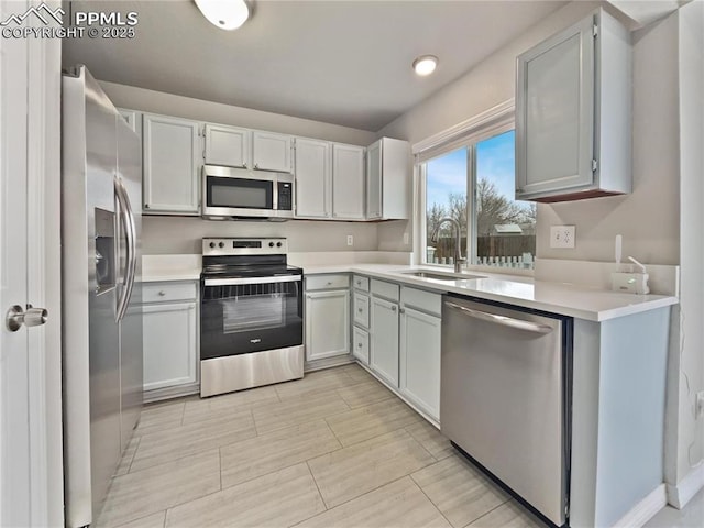 kitchen with white cabinetry, sink, and appliances with stainless steel finishes