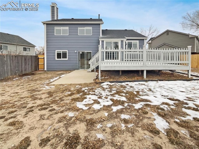 rear view of property with a patio and a deck