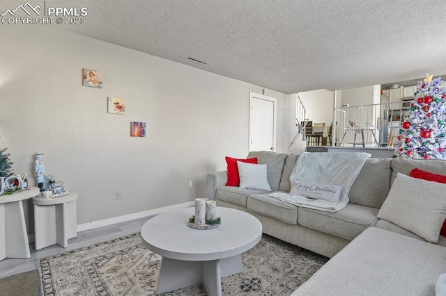 living room with a textured ceiling