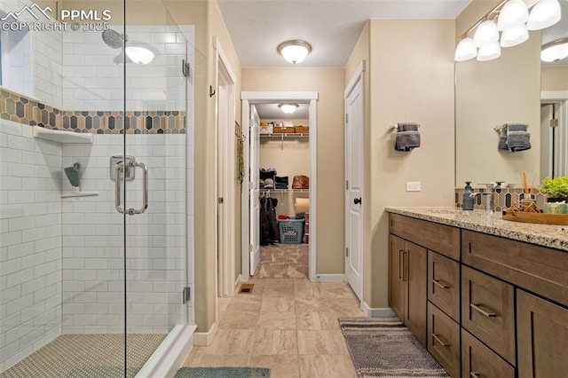 bathroom with vanity and an enclosed shower