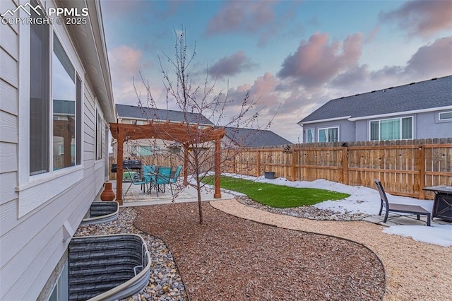 yard at dusk with a pergola and a patio