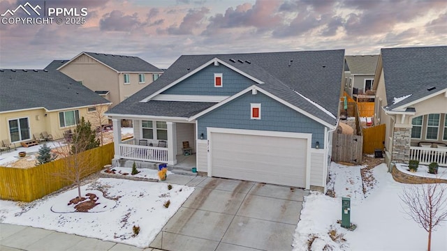 view of front of house featuring a garage and covered porch