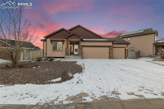 view of front of property with a garage