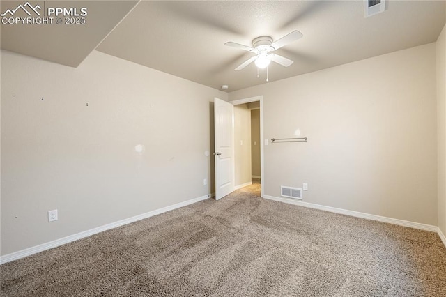 empty room with ceiling fan and carpet floors