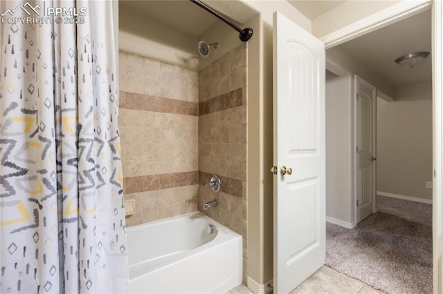 bathroom with tile patterned floors and shower / tub combo