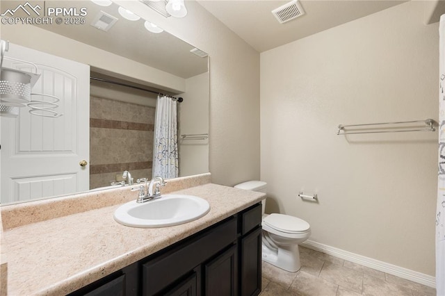 bathroom featuring tile patterned flooring, vanity, curtained shower, and toilet