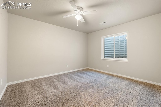 carpeted empty room featuring ceiling fan