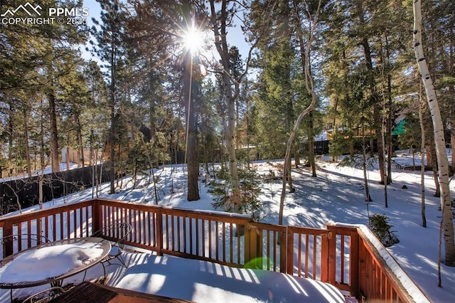 view of snow covered deck