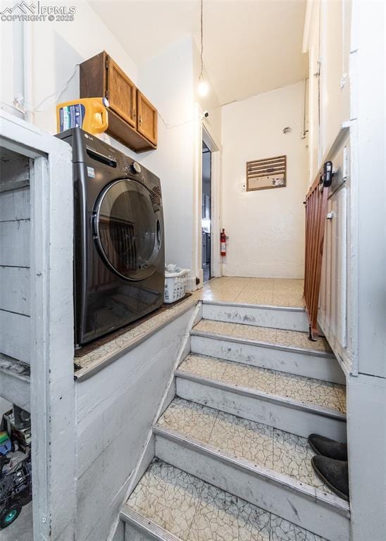 staircase featuring washer / clothes dryer