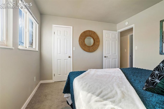 bedroom featuring light colored carpet