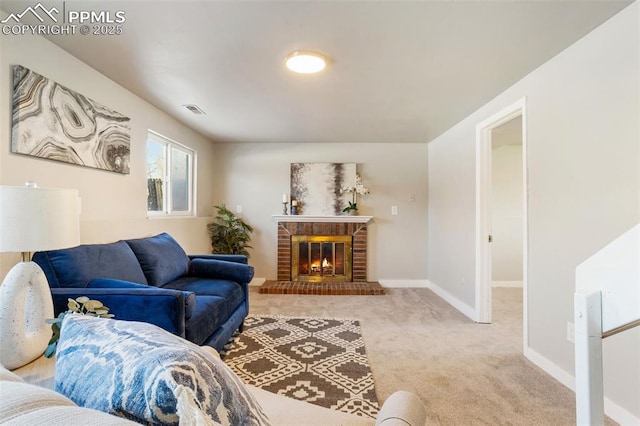 carpeted living room featuring a fireplace