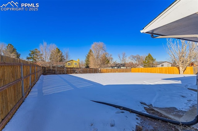 view of yard covered in snow