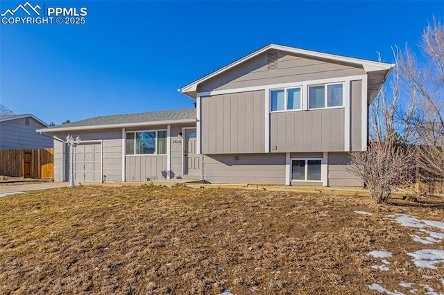 split level home featuring a garage