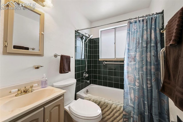 full bathroom with shower / tub combo, vanity, and toilet