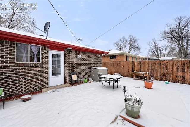 view of snow covered patio