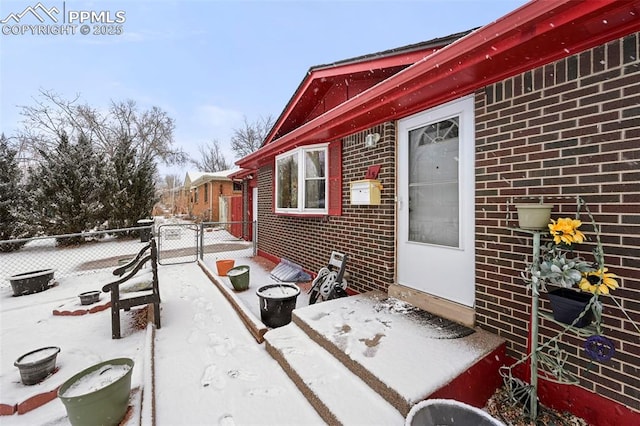 view of snow covered property