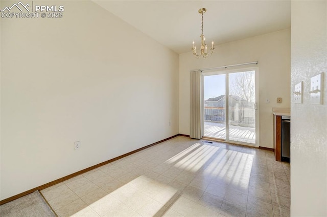 unfurnished dining area with an inviting chandelier