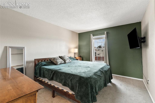 carpeted bedroom with a textured ceiling