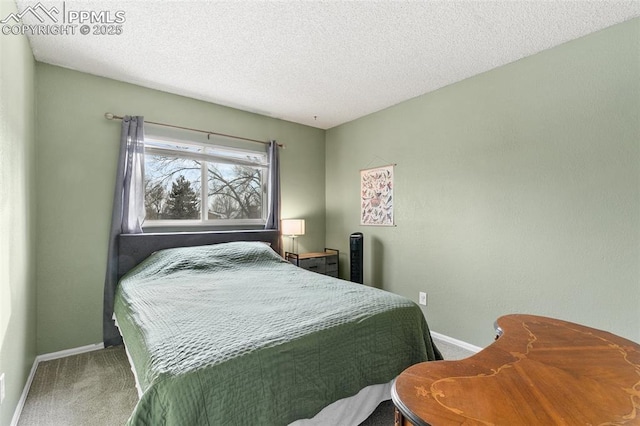 carpeted bedroom featuring a textured ceiling