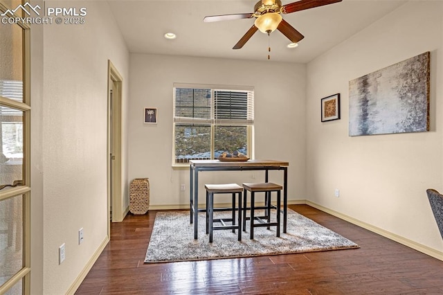 dining space featuring ceiling fan and dark hardwood / wood-style floors