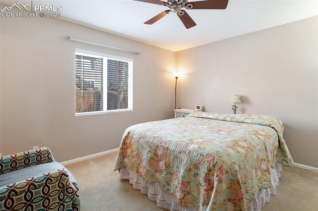 bedroom featuring ceiling fan and light colored carpet