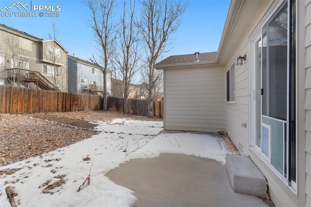 view of yard layered in snow