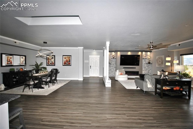 living room with crown molding, ceiling fan, and dark hardwood / wood-style flooring