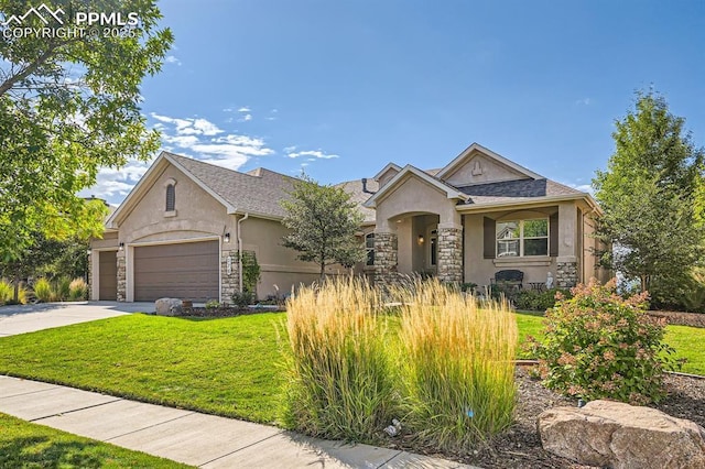 view of front of house with a garage and a front lawn