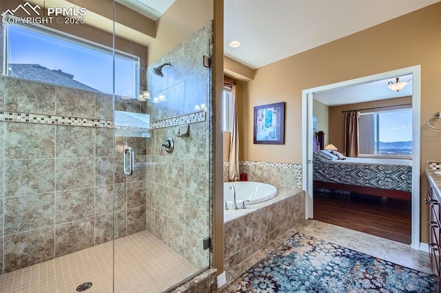 bathroom with shower with separate bathtub