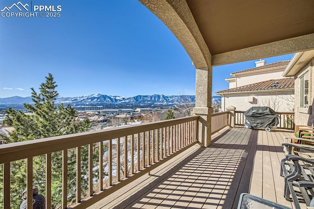 balcony with a mountain view and grilling area