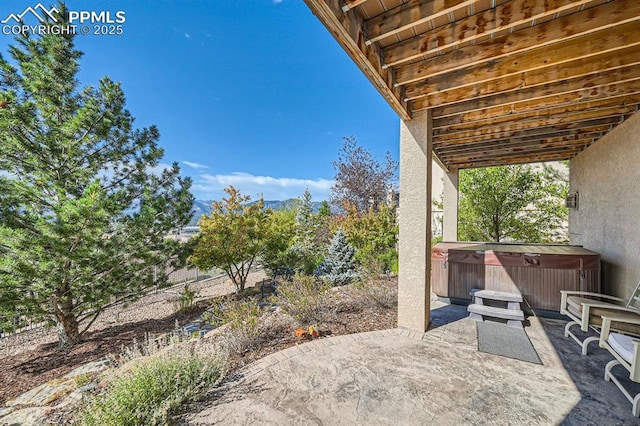 view of patio featuring a hot tub