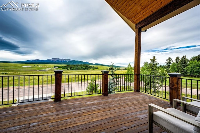 deck featuring a mountain view and a rural view