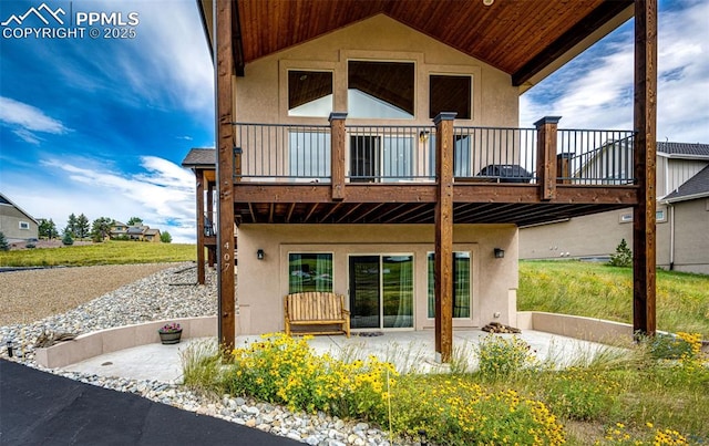 back of property with a wooden deck