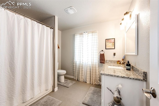 full bathroom featuring vanity, shower / bath combo, tile patterned floors, and toilet