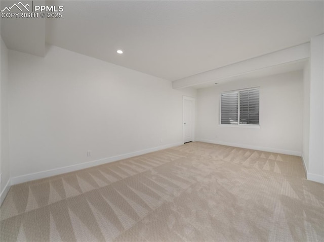 empty room with baseboards, carpet, and recessed lighting