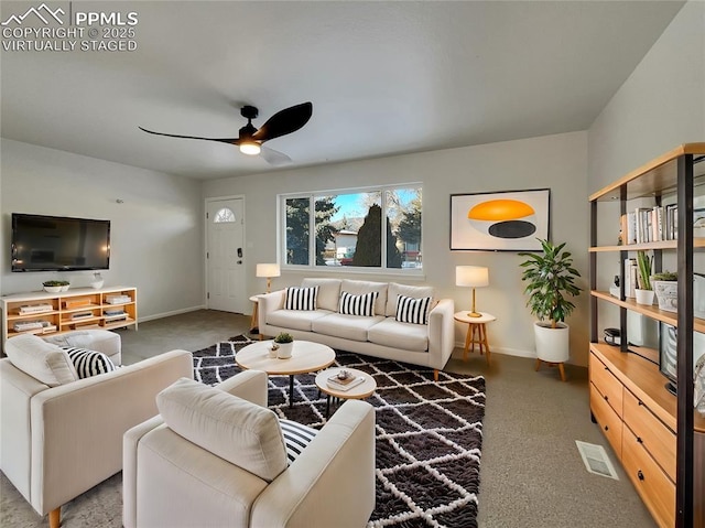 living room featuring ceiling fan and carpet floors